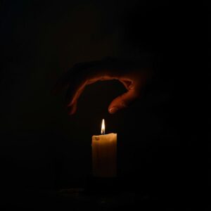 Day 15: The Light in the Darkness 1 he Stolen Light A hand reaching into a dark room snuffing out the single candle that was providing light and warmth